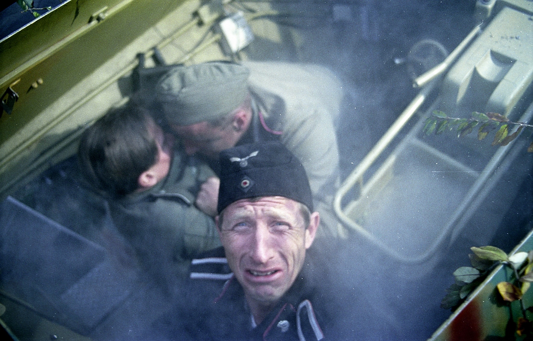 Kruger in despair inside a vehicle hatch