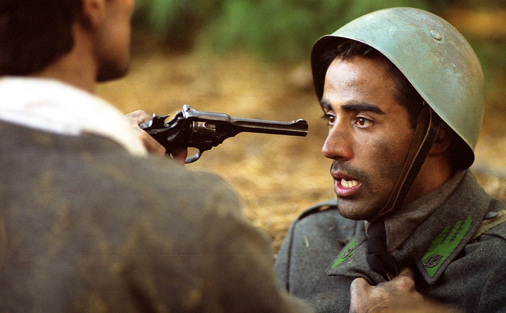 Italian soldier at gunpoint, close-up portrait