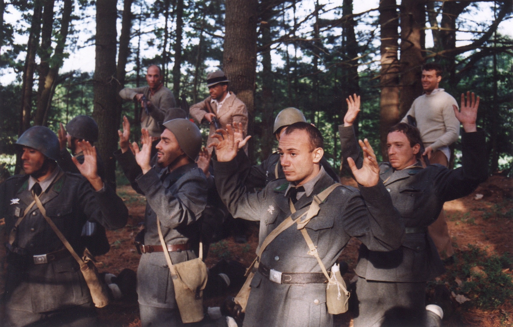 Italian soldiers surrendering with hands raised in the forest